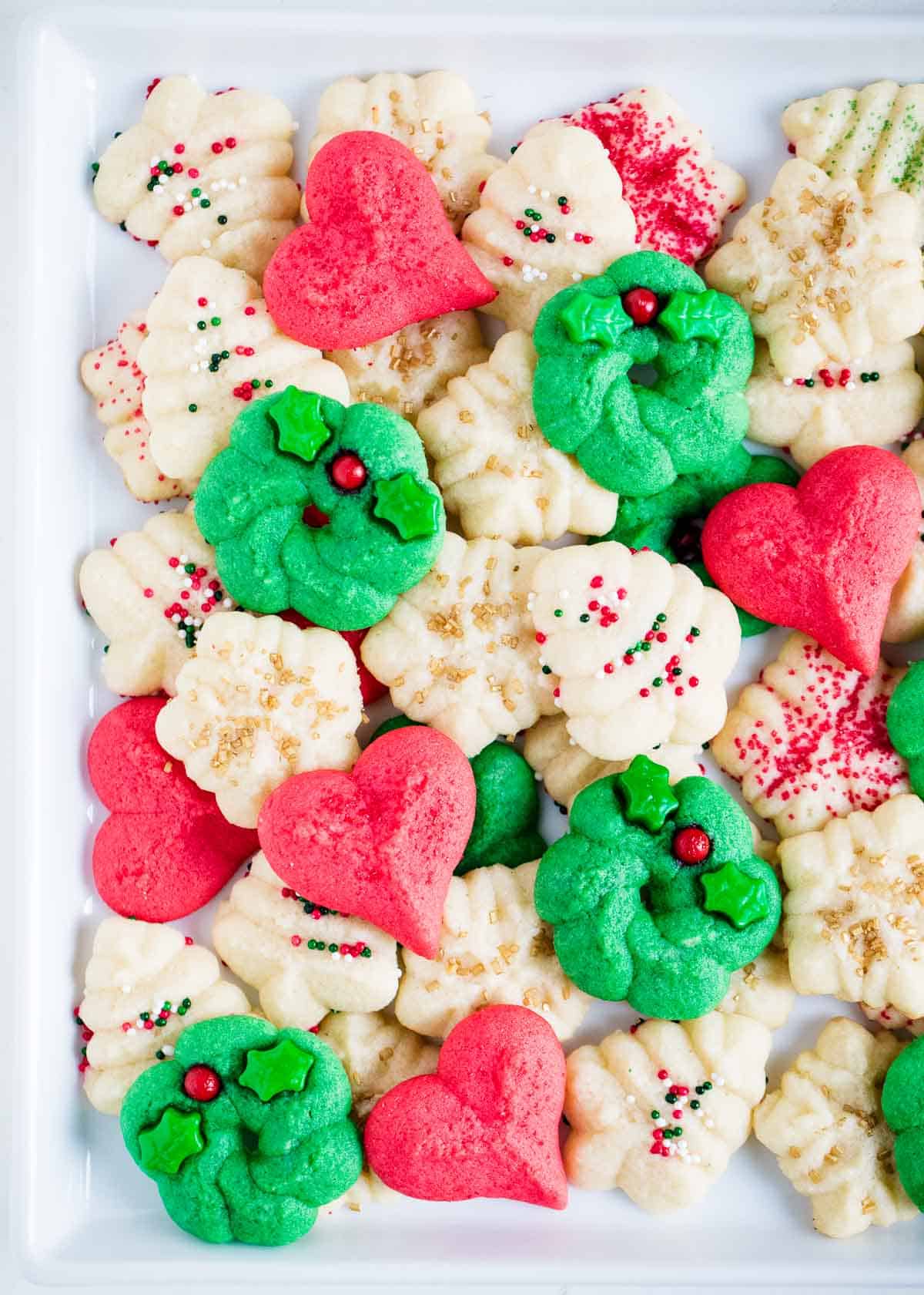 Christmas spritz cookies on plate.