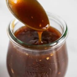 Close up of teriyaki sauce in jar.