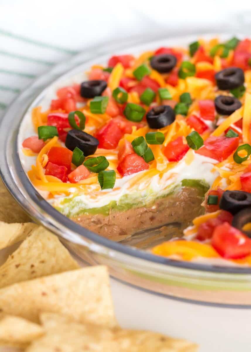 5 layer dip in dish with chips.