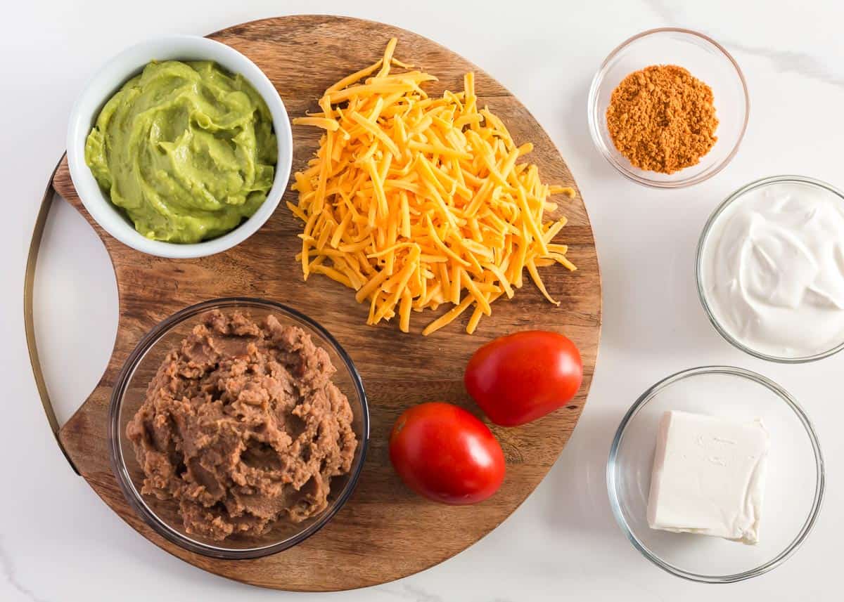 5 layer dip ingredients on board.