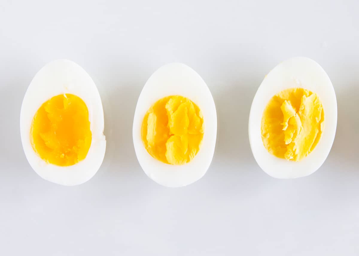 3 hard boiled eggs on counter.