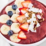 acai smoothie in bowl with fruit and toppings