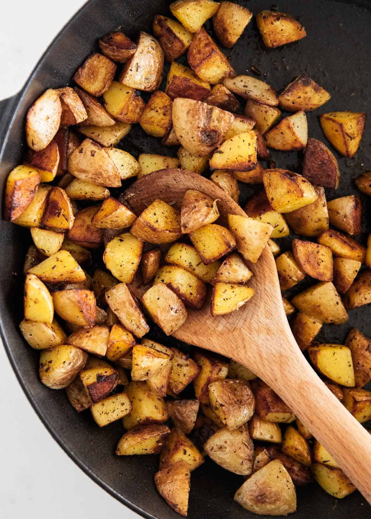 Cast iron skillet potatoes in pan.