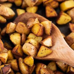 Close up of cast iron skillet potatoes in a cast iron pan.