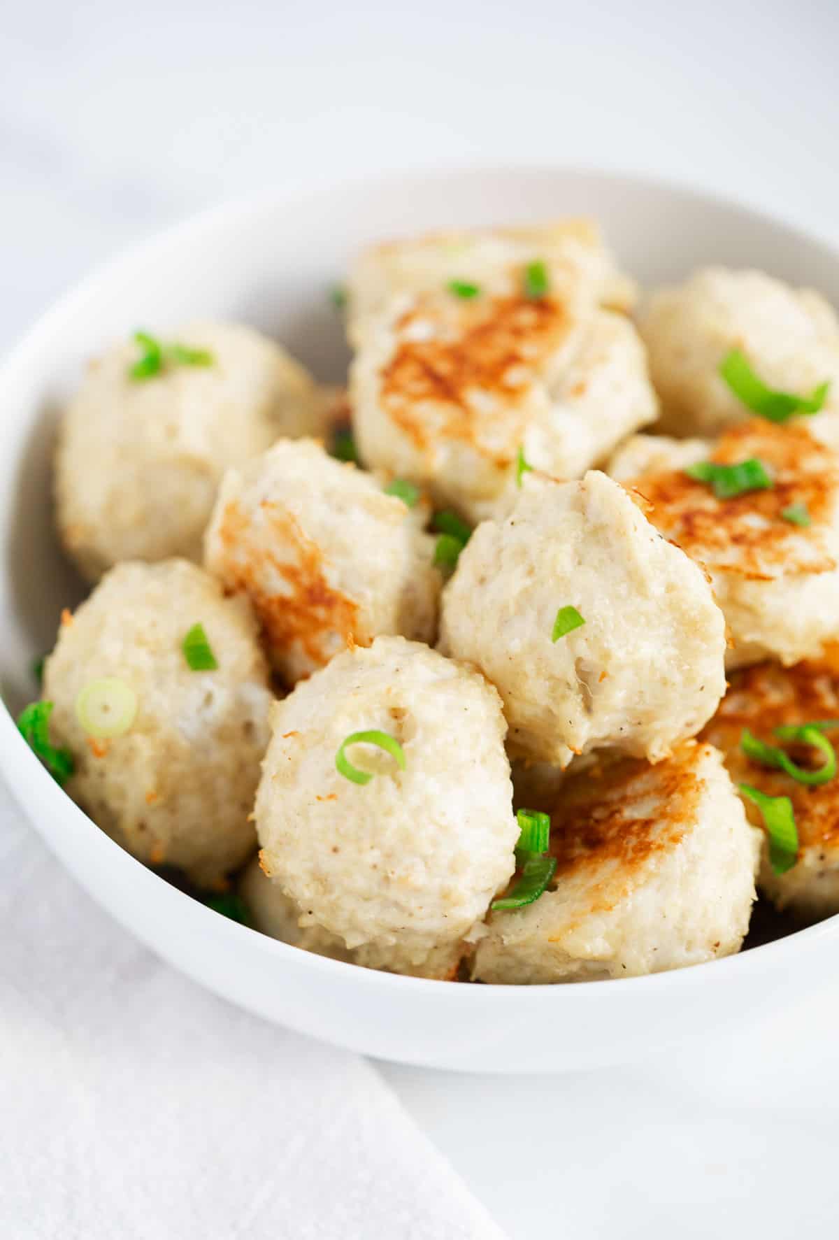 Chicken meatballs in bowl.