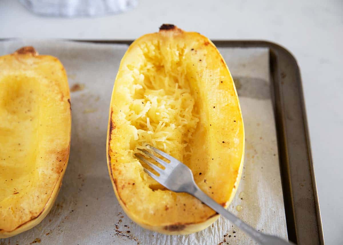 Cooked spaghetti squash on pan.