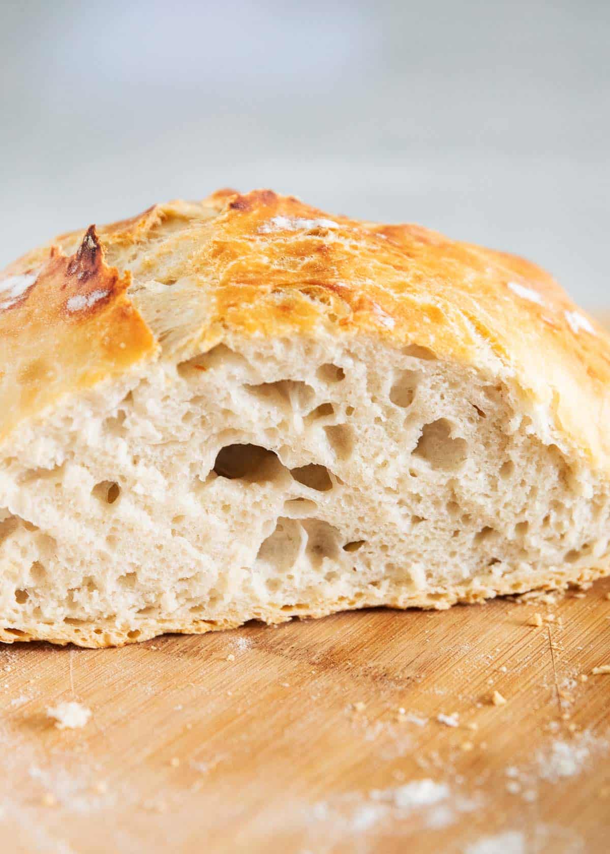 Dutch oven bread on cutting board.