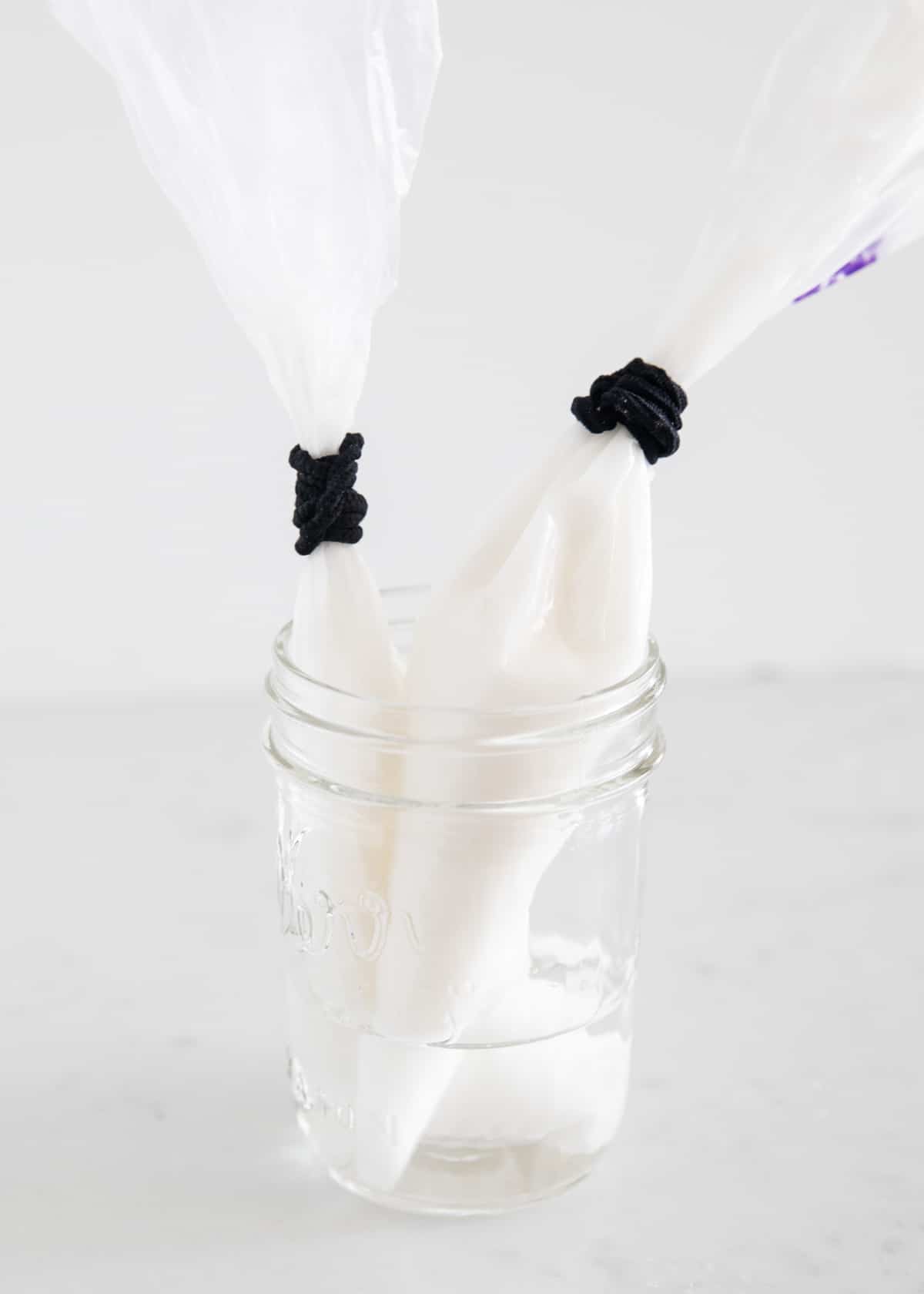 icing in piping bags in jar