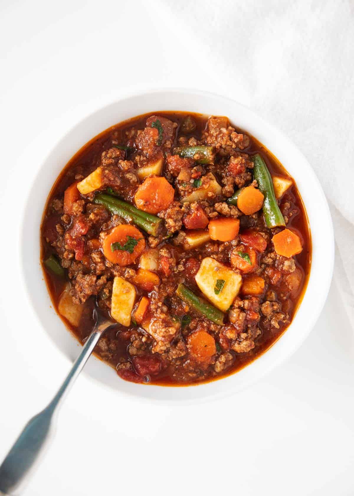 Hamburger in white bowl.