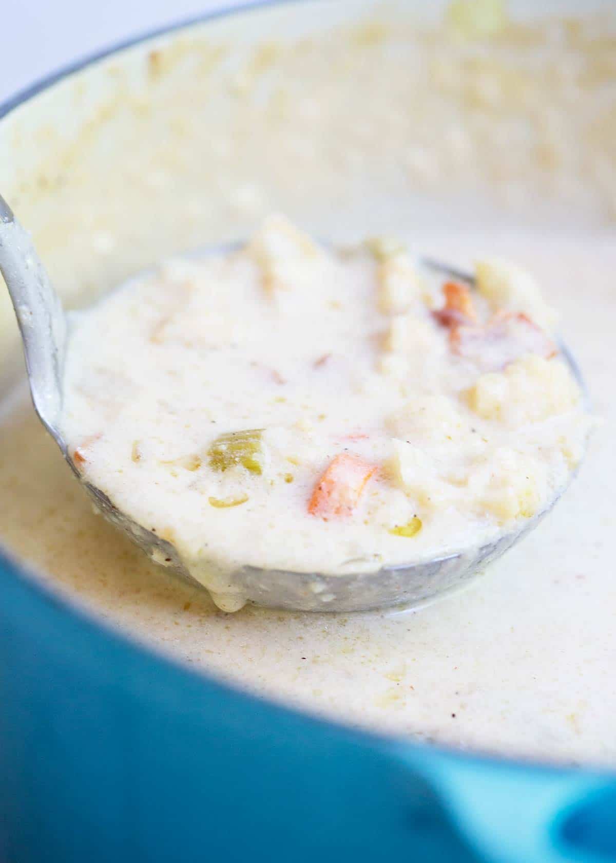 Ladle of roasted cauliflower soup.