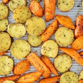 roasted potatoes and carrots on pan