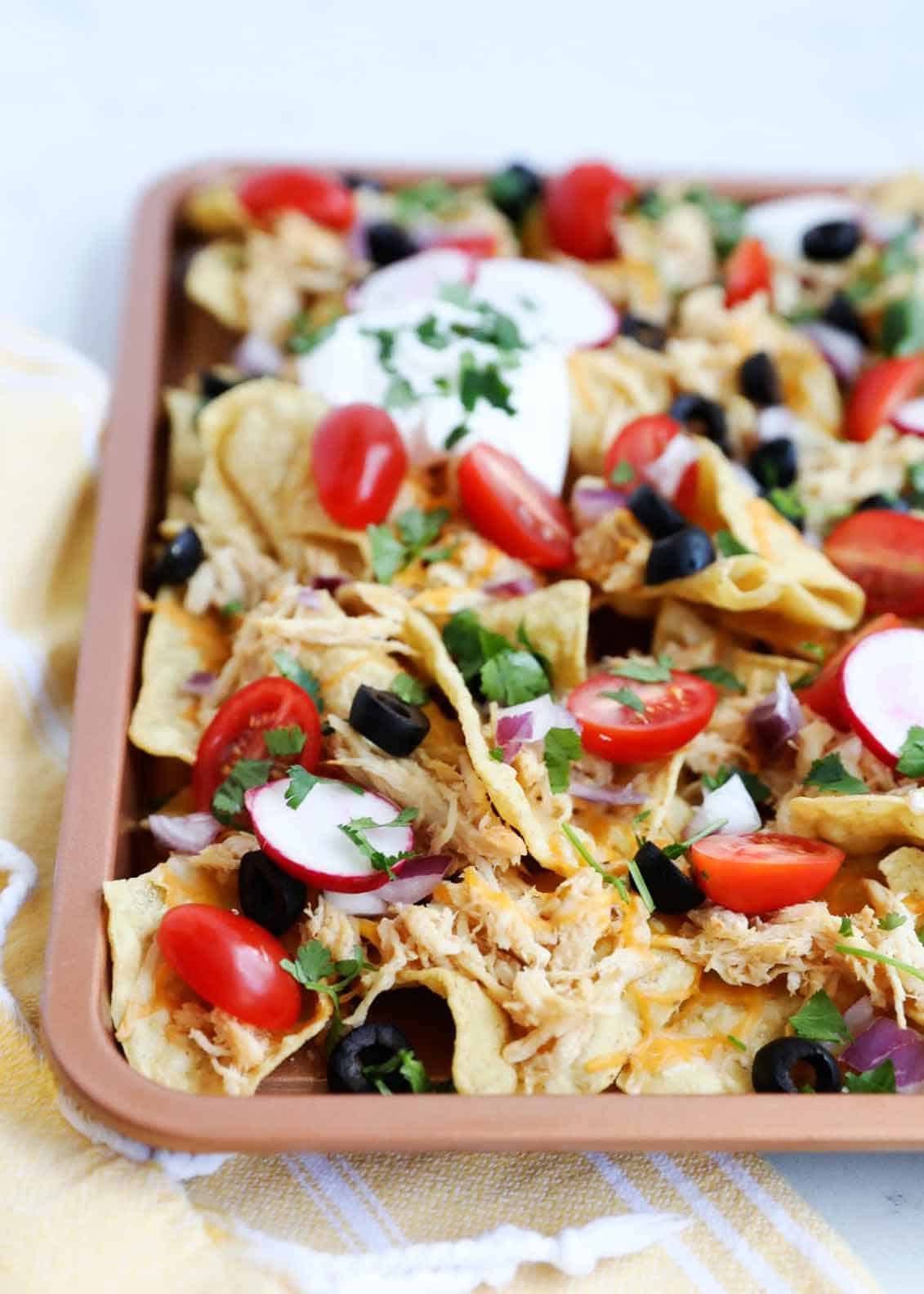 Close up of sheet pan nachos.