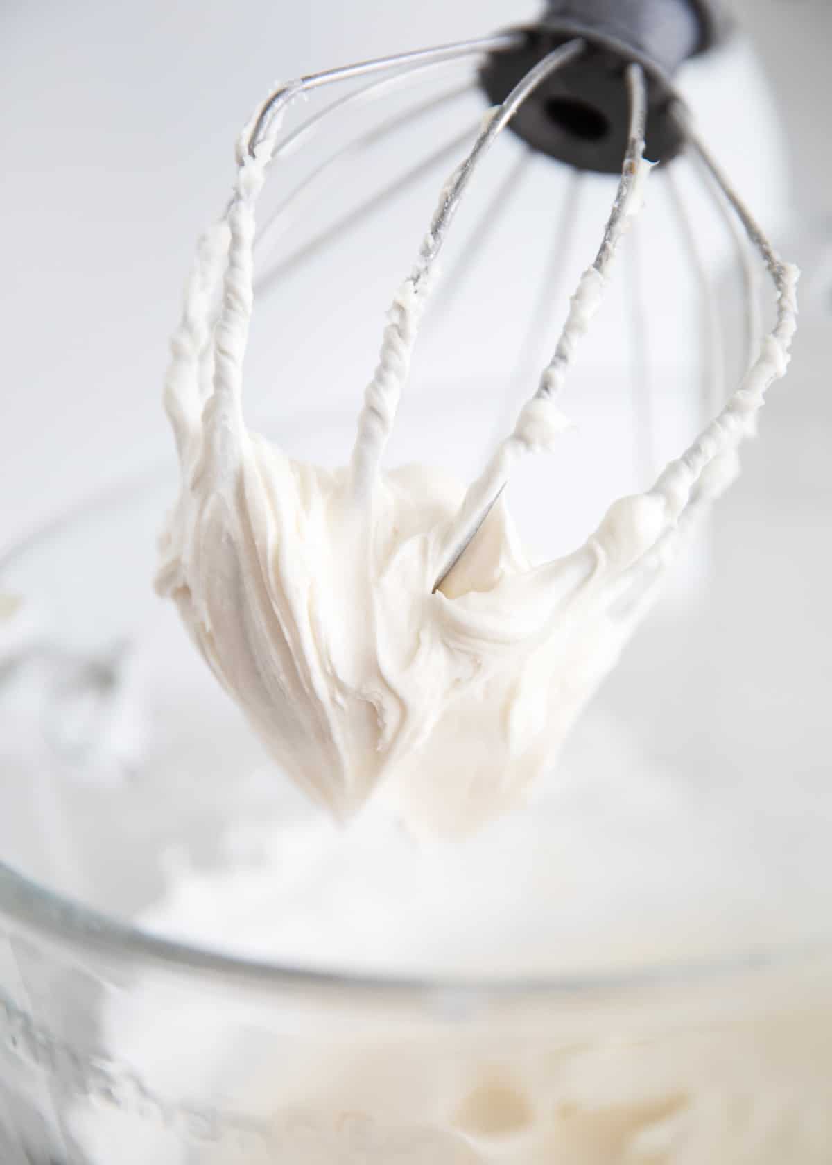 sour cream frosting in clear bowl