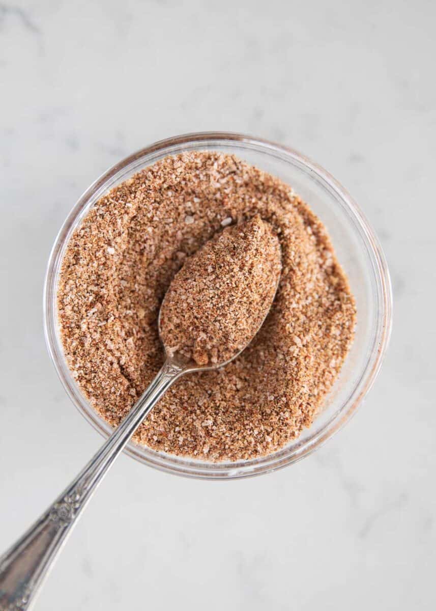 Steak rub in clear bowl.