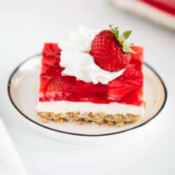 strawberry pretzel salad on white plate