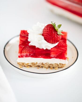 strawberry pretzel salad on white plate