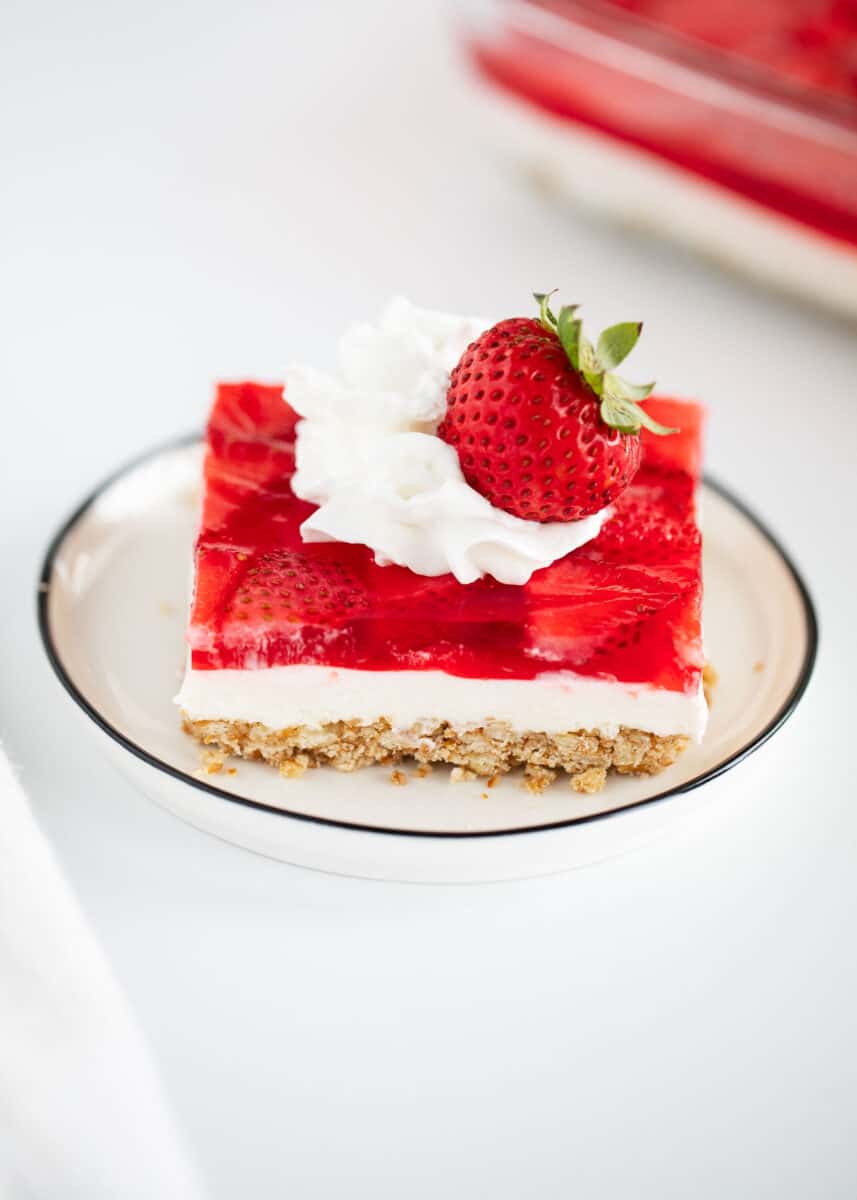 strawberry pretzel salad on white plate