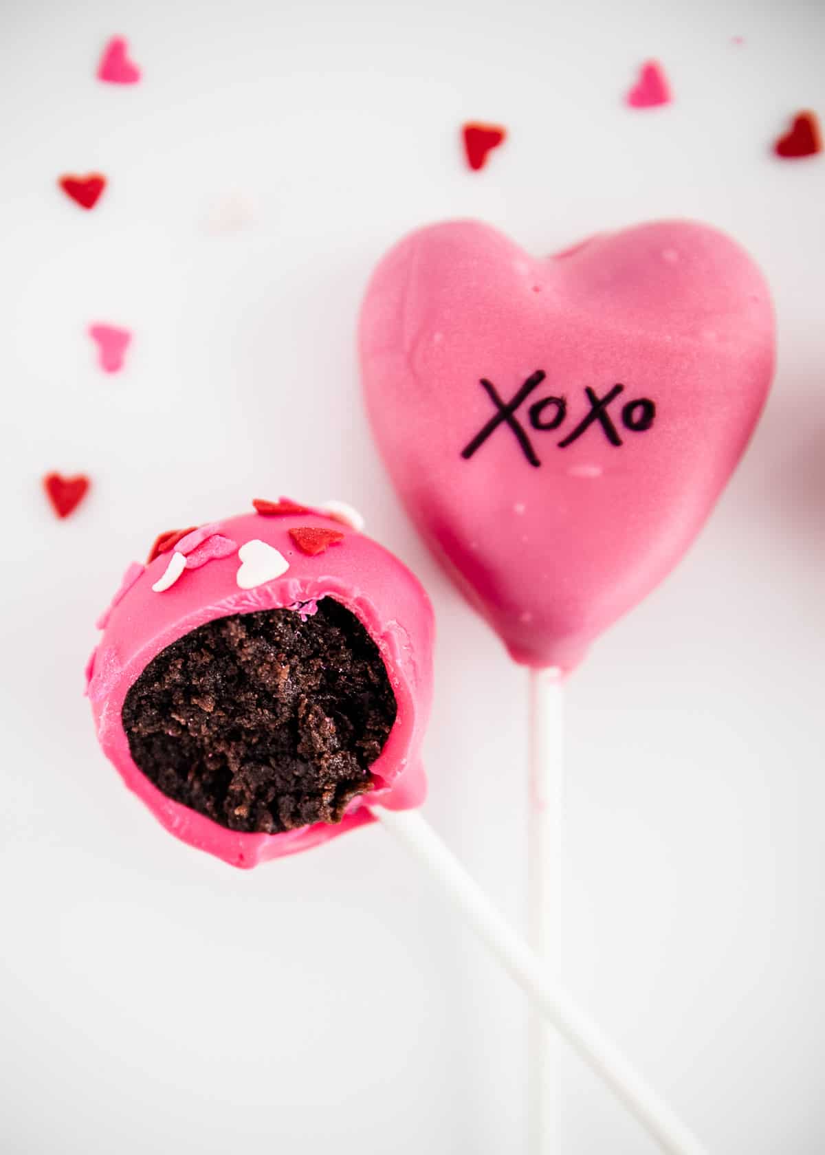 Bite out of valentine cake pop.