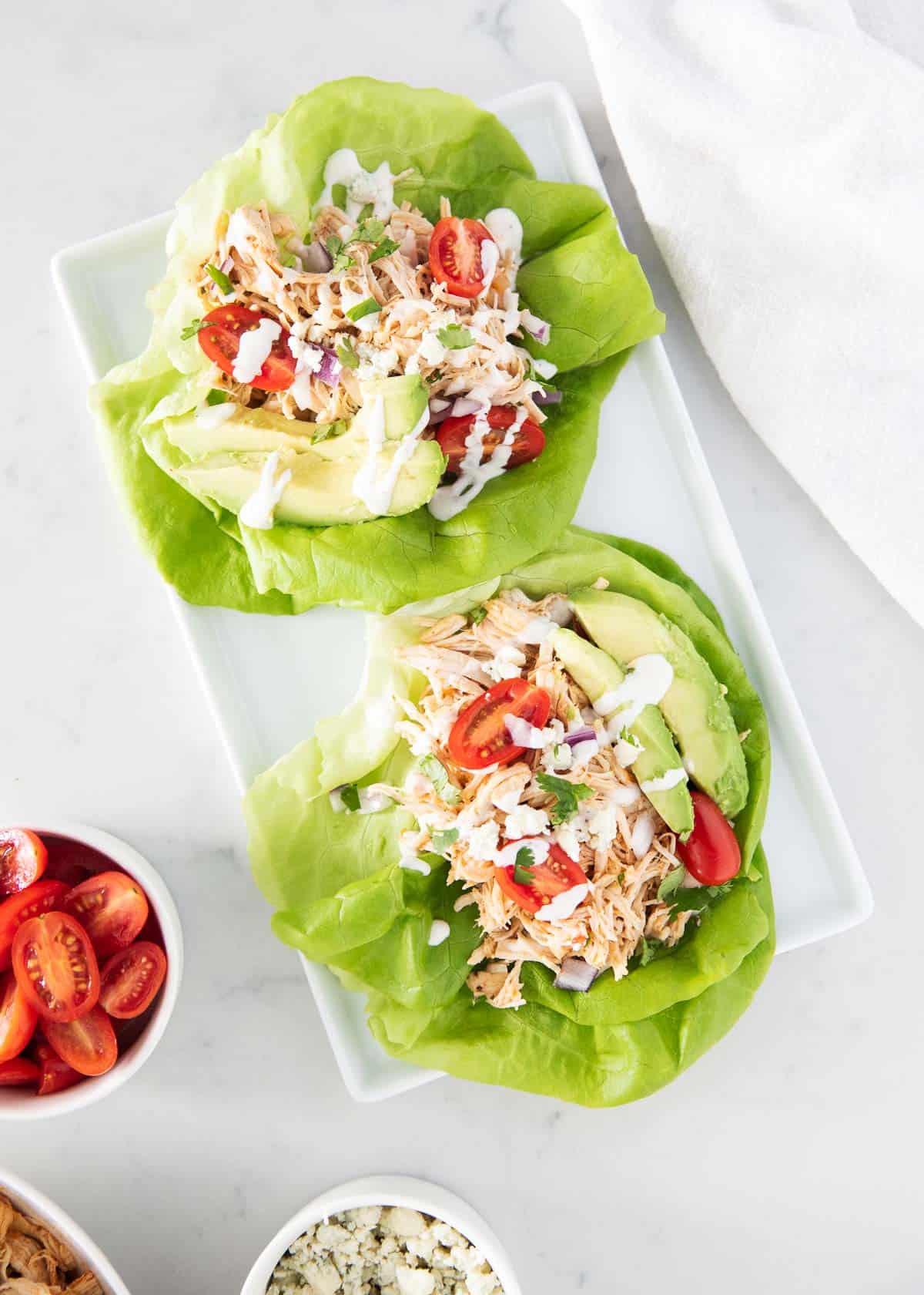 Buffalo chicken lettuce wraps on plate.