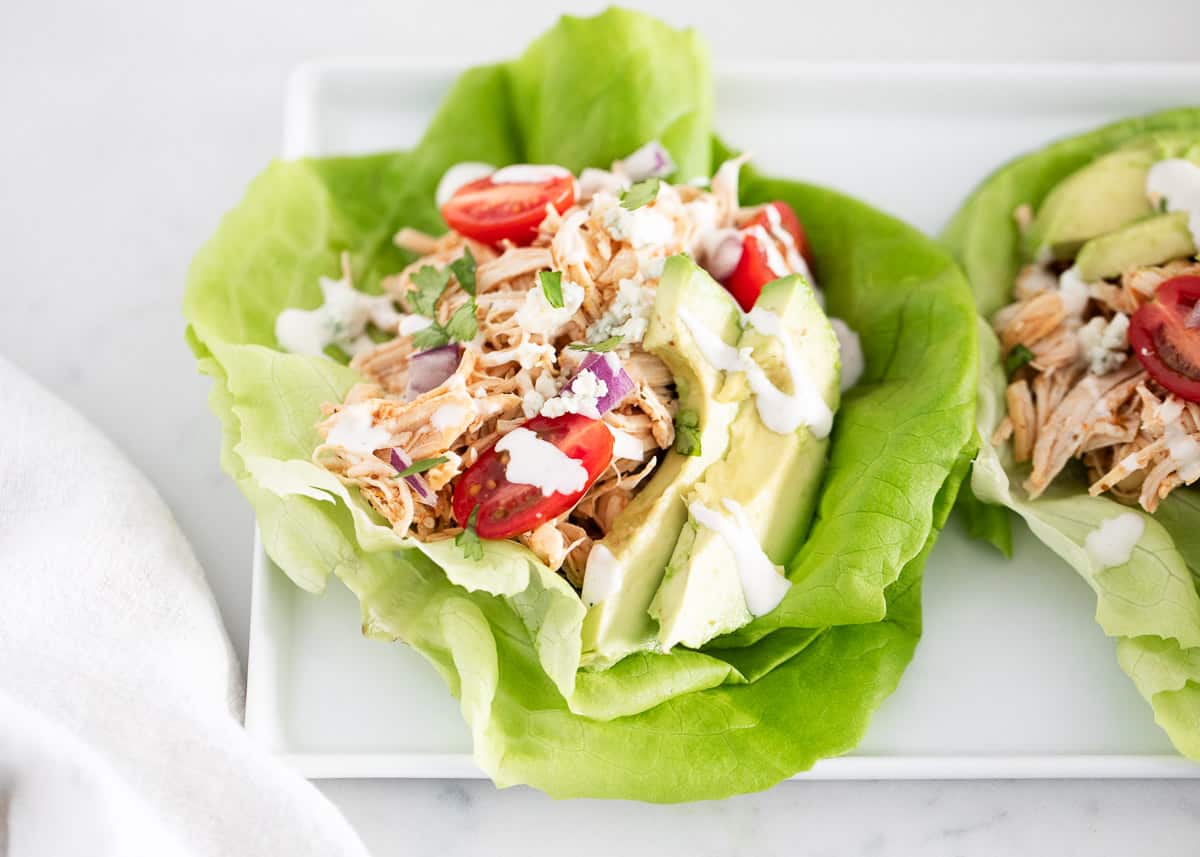 Buffalo chicken lettuce wraps on plate.