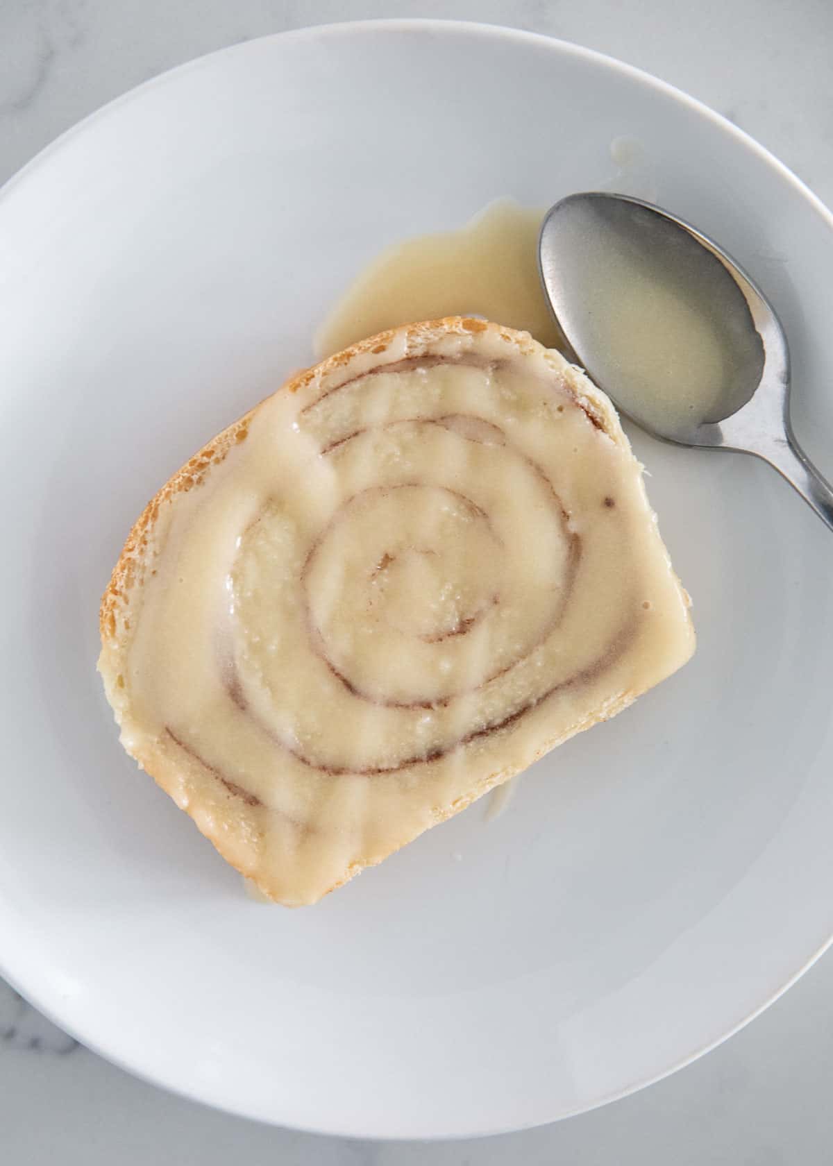 Cinnamon swirl bread slice on plate.