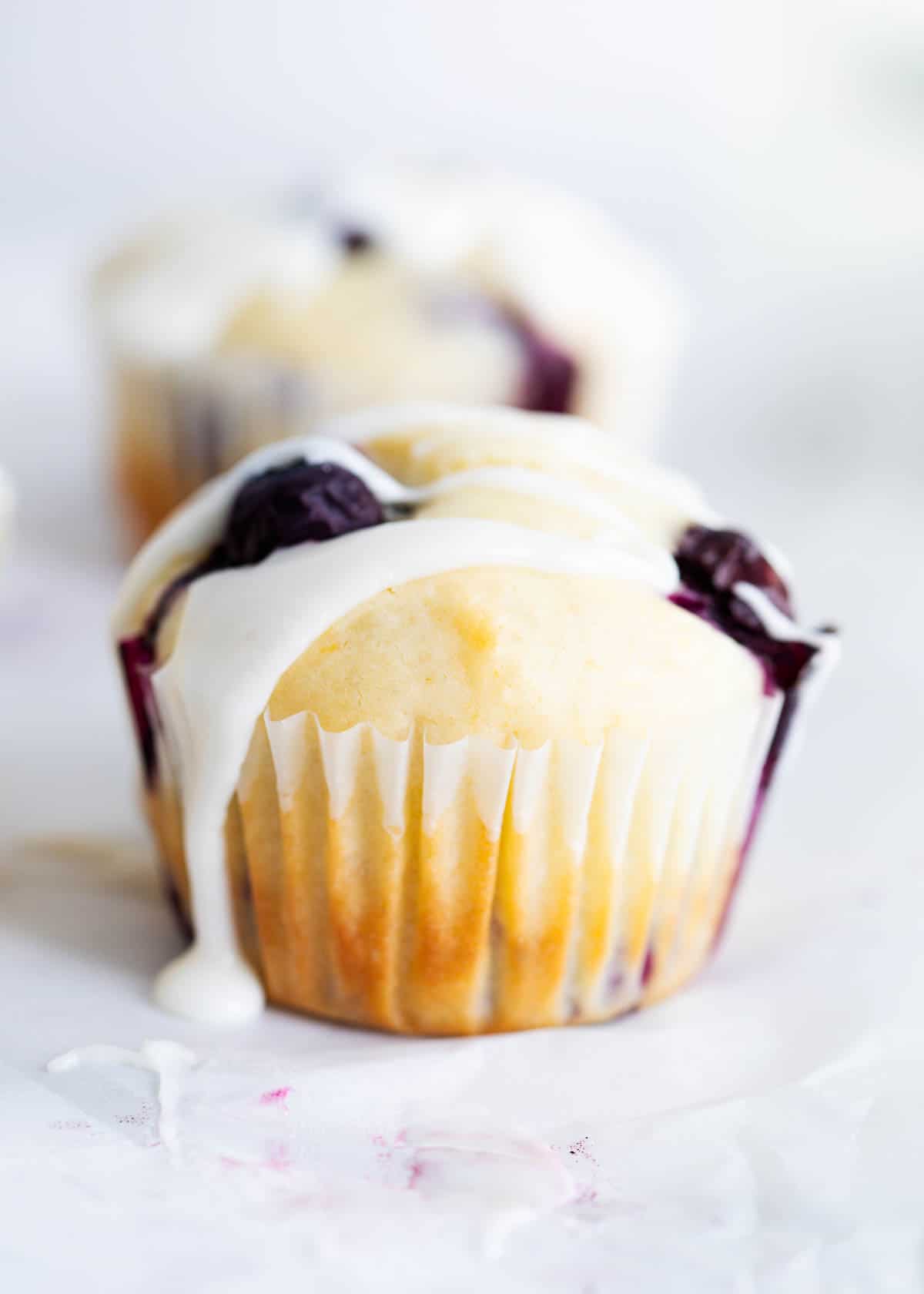 Lemon blueberry muffins with lemon glaze on top. 