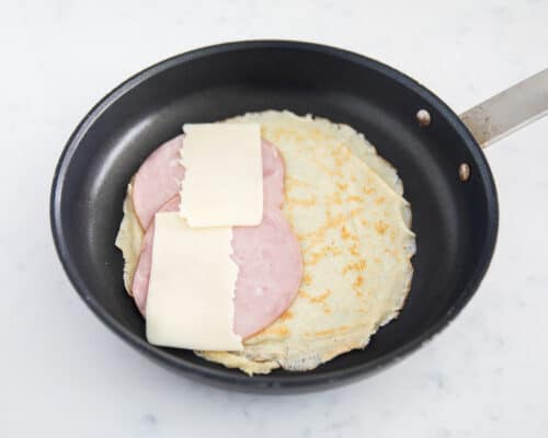 ham and cheese crepe ingredients on pan