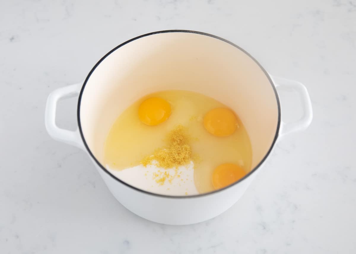 Lemon curd ingredients in pot.