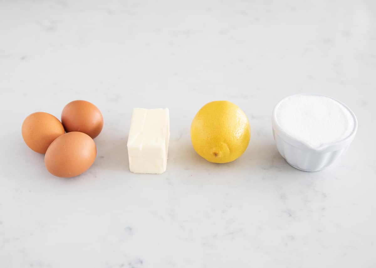 Lemon curd ingredients on table.