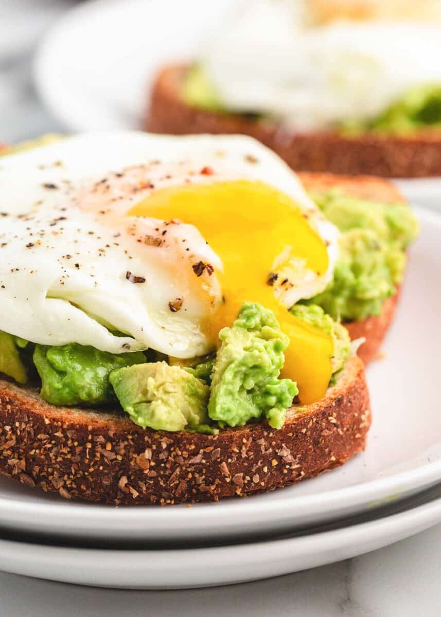 runny egg yolk on avocado toast