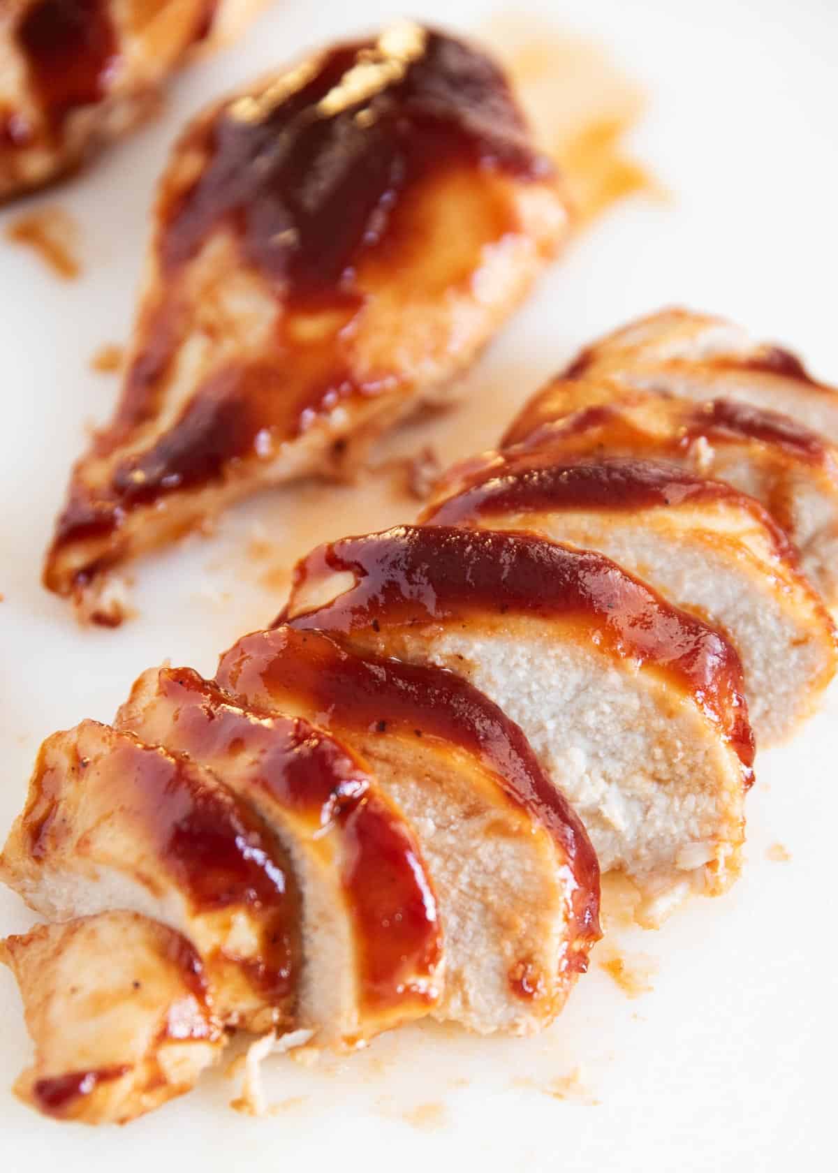 Baked bbq chicken slices close up.