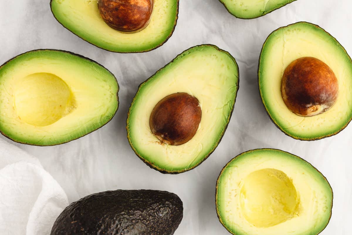 Sliced avocados on counter.