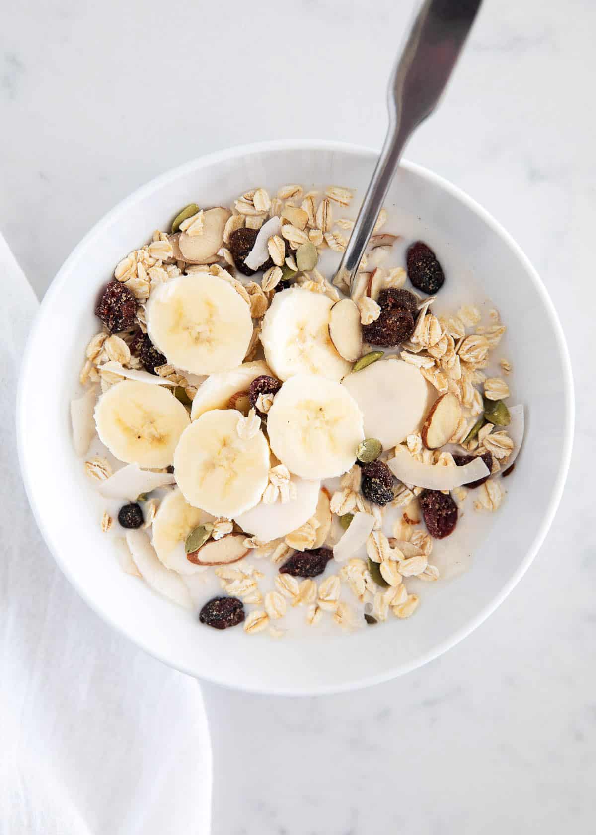 Muesli in white bowl.