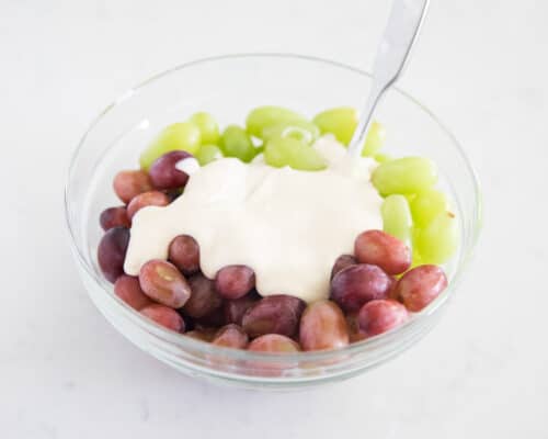 grape salad ingredients in clear bowl