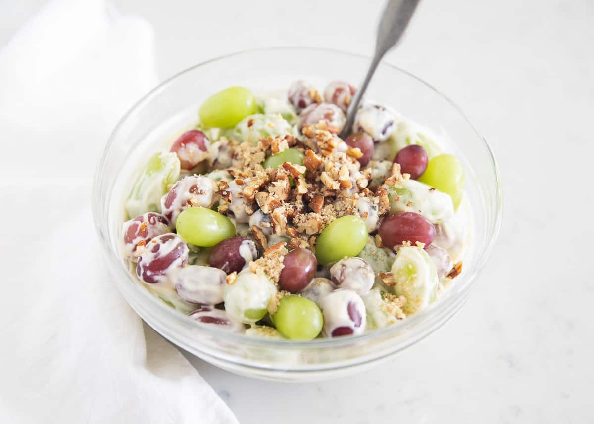 Grape salad in clear bowl.