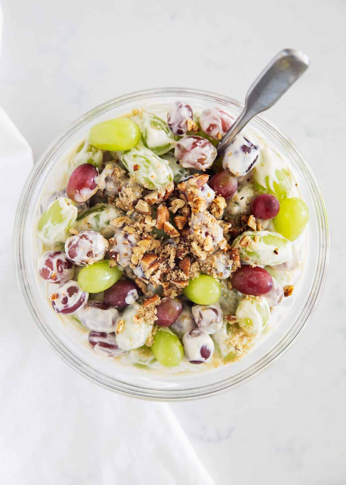 Grape salad in clear bowl.