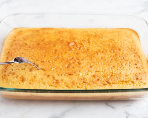 tres leches cake in clear pan