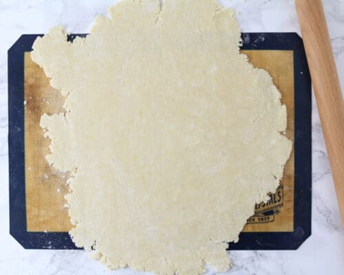 rolling dough out on mat