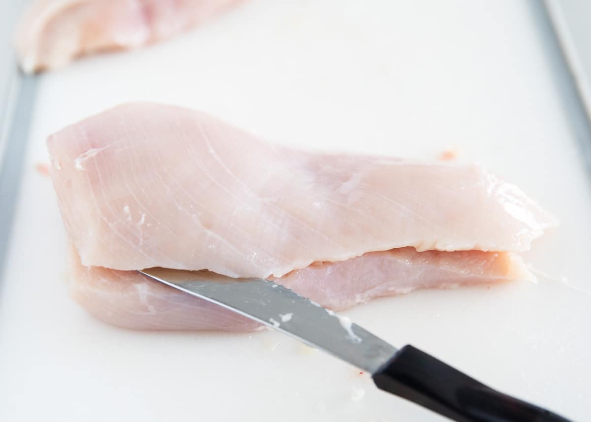 Chicken breast on cutting board. 