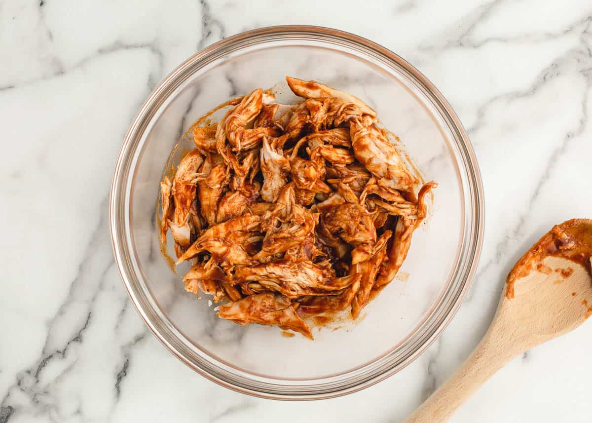 Bbq chicken in clear bowl.