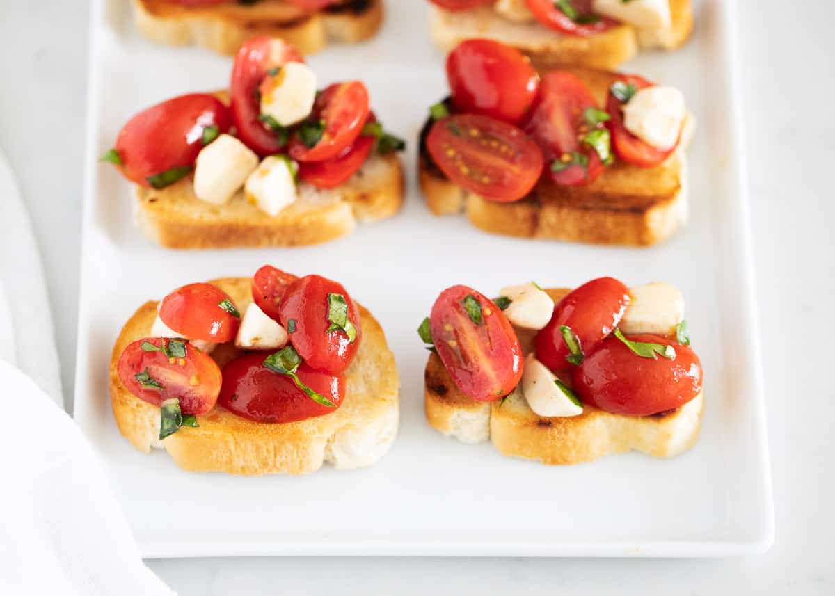 Caprese bruschetta on plate.