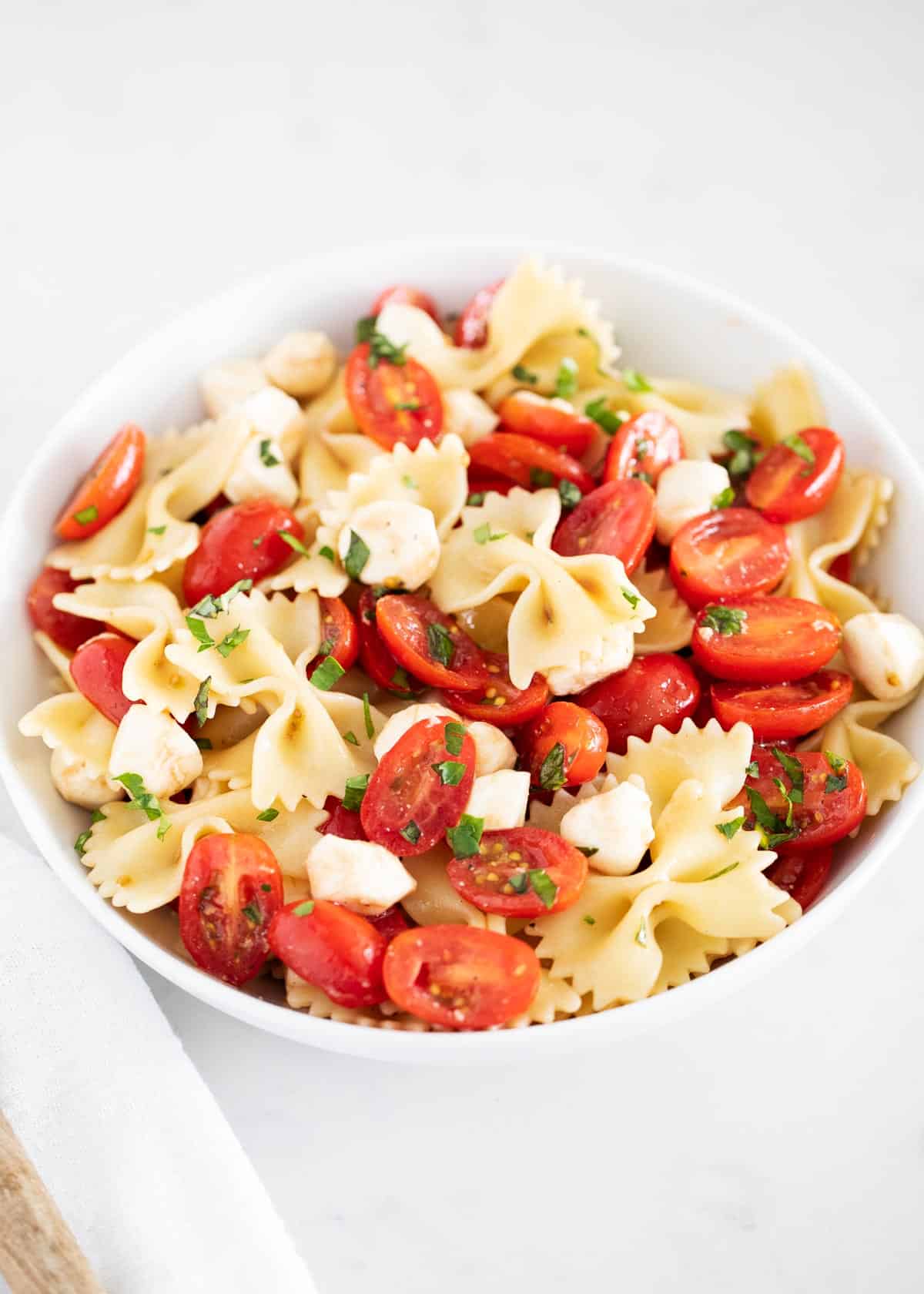 Caprese pasta salad in bowl.