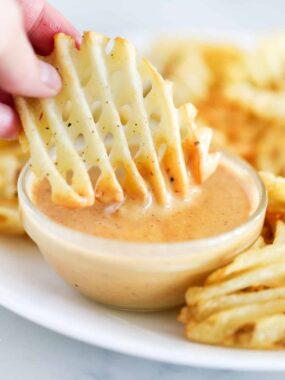 waffle fry dipped in sauce