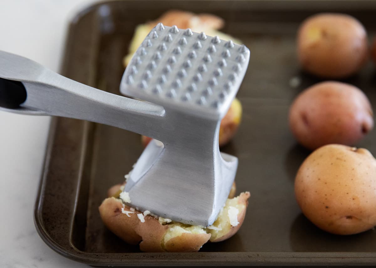 smashing potatoes on pan