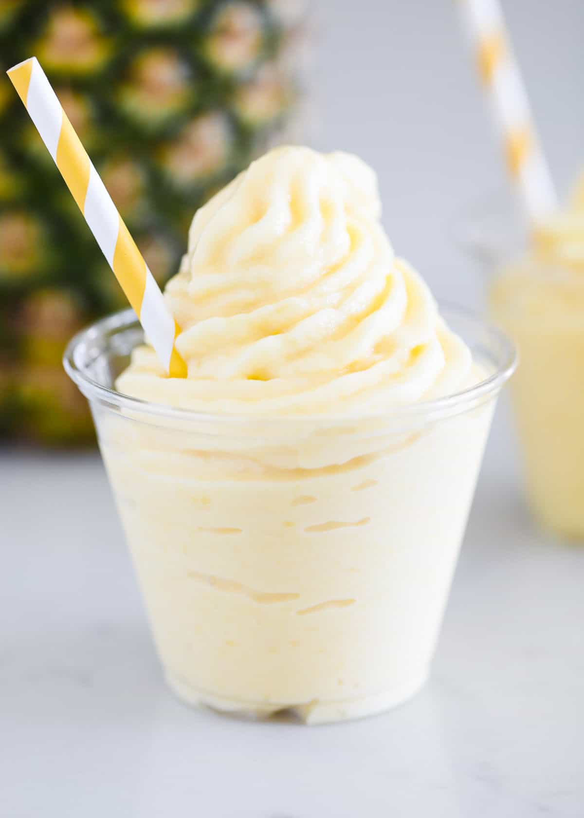 Dole whip in plastic cup.