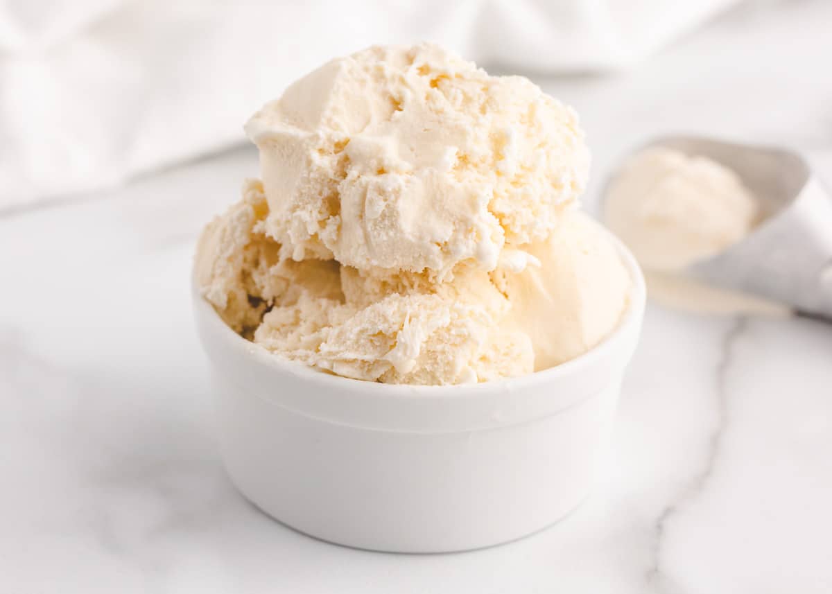 Vanilla ice cream in white bowl.