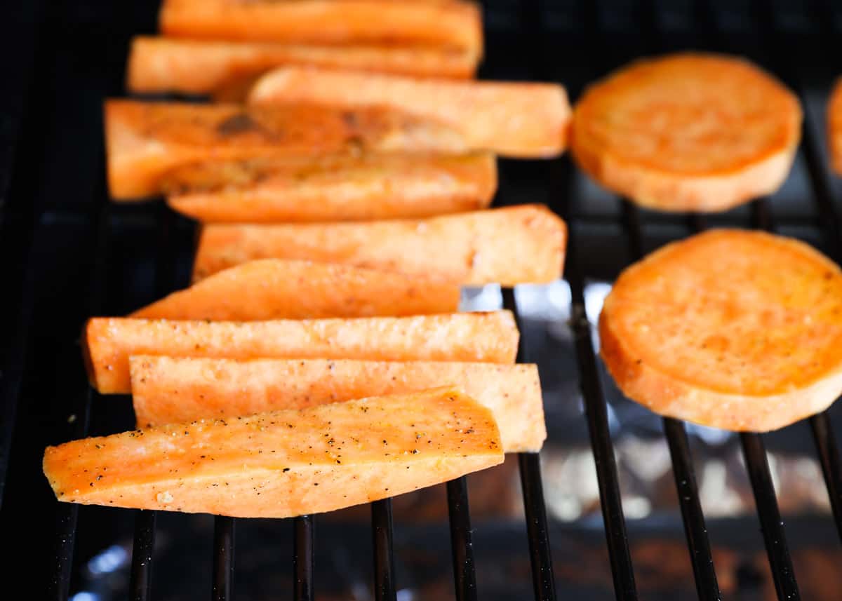 Cut sweet potatoes on grill.