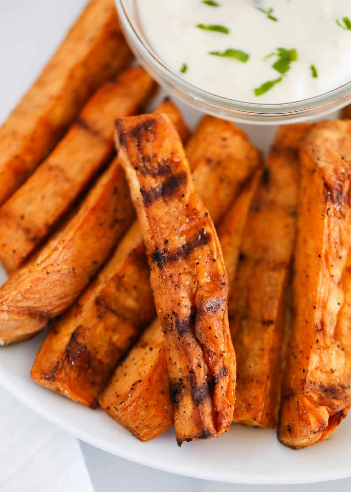 Grilled sweet potatoes on plate.