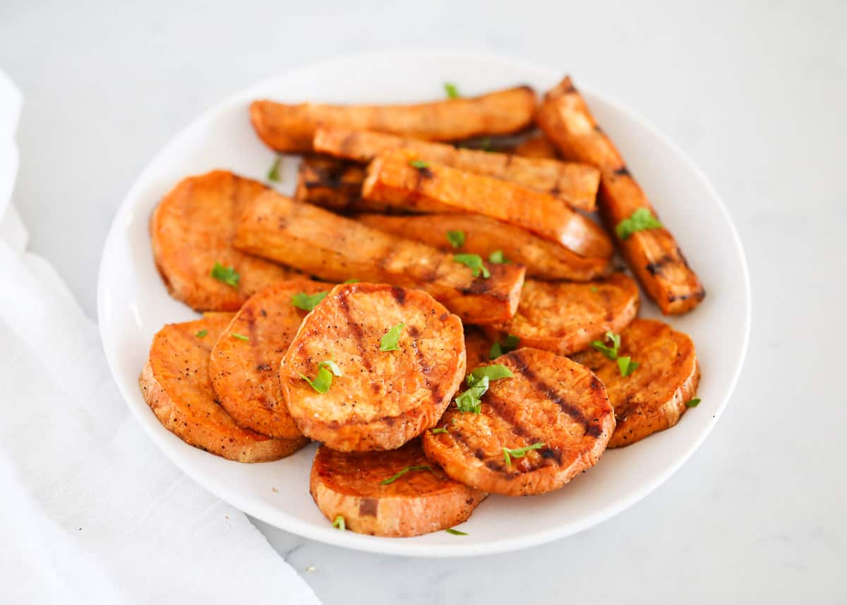 Grilled sweet potatoes on plate.