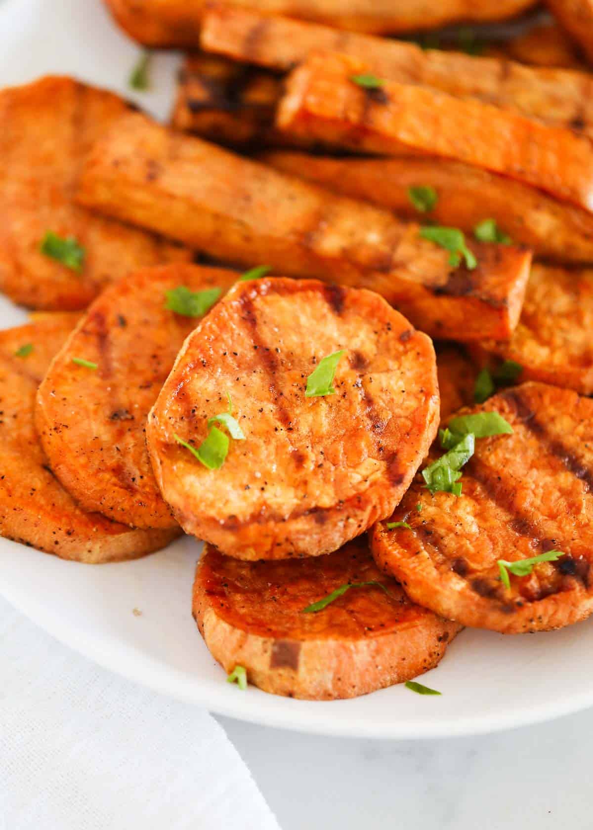 Grilled sweet potatoes on plate.